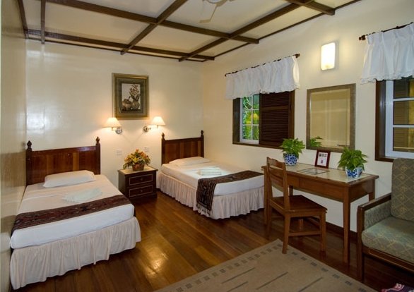 Chalet room with 2 single beds, a writing desk and an armchair at Sipadan-Mabul Resort (placeholder, to recheck when the photo is replaced)